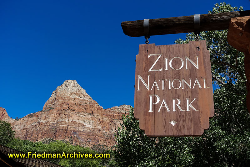 zion,national,park,sign,establishing,shot,blue,sky,postcard,mountain,